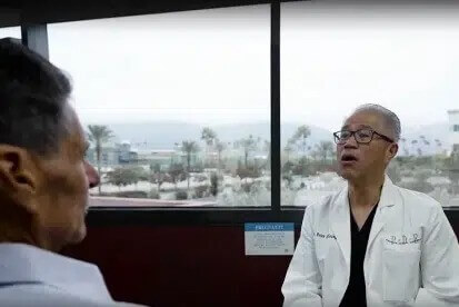 upland dentist discussing emergency dental concerns with patient