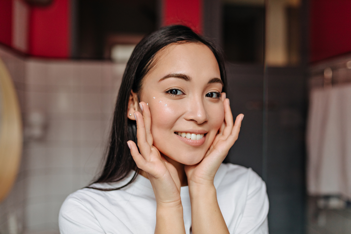woman showing smiles after fixing gapped teeth
