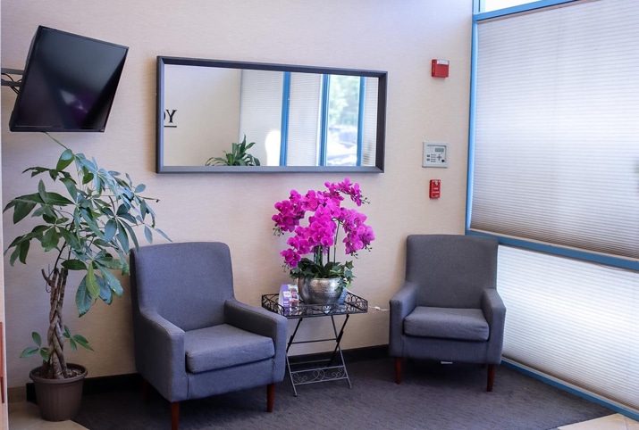 Comfortable patient waiting area seating inside Young Dental Health Center Upland